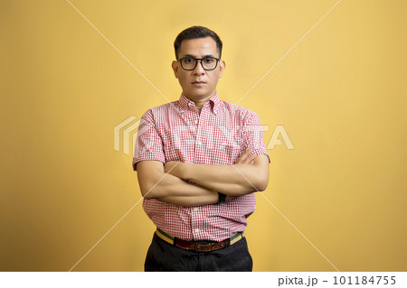 Man with eyeglasses and a shirt standing 101184755