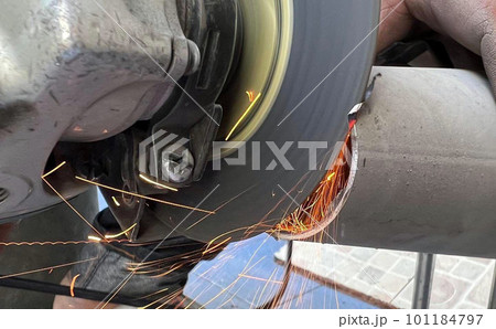 Worker cutting metal by industry tool cutting steel. industrial manufacturing theme Worker cutting metal by industry tool cutting steel. industrial manufacturing theme 101184797