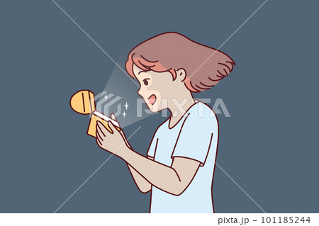 Little girl opens golden box and is delighted to see contents shining and illuminating child face Little girl opens golden box and is delighted to see contents shining and illuminating child face 101185244