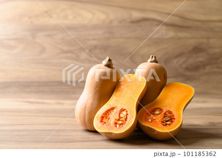 Half butternut squash on wooden background, Organic vegetables 101185362