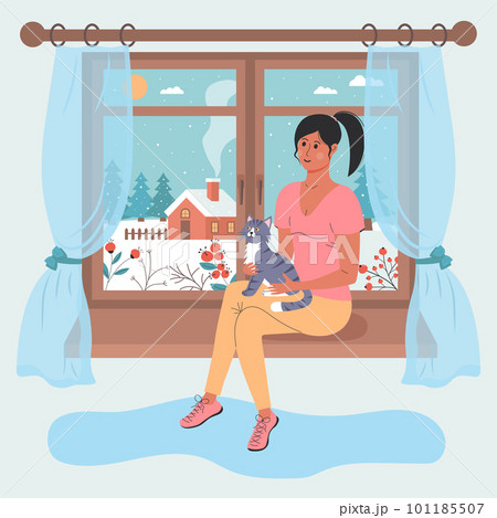 Girl with a cat sitting on the window. There is a winter day landscape outside the window. Winter mood, pet, relaxing, cozy home concept. 101185507