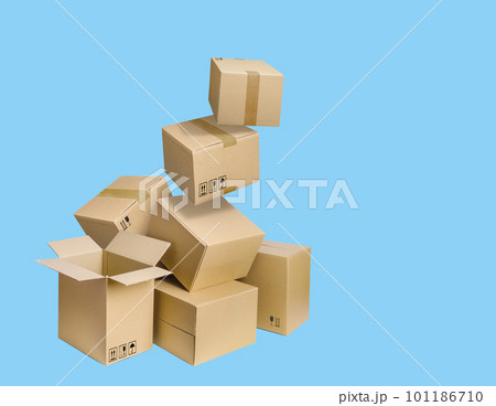 Cardboard parcel boxes falling on blue background 101186710