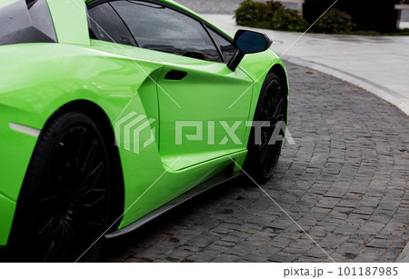 sportcar is parked in street. 101187985