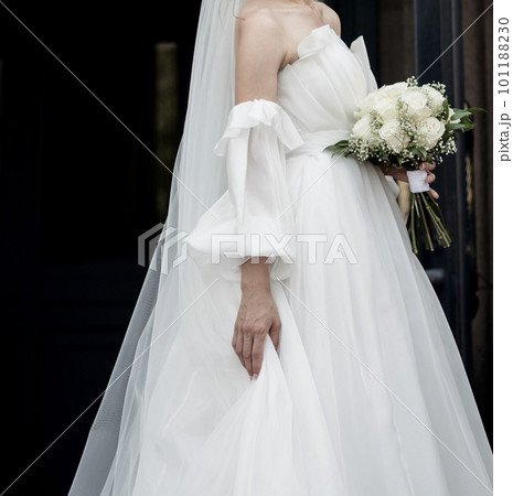 bride in dress holding wedding bouquet 101188230
