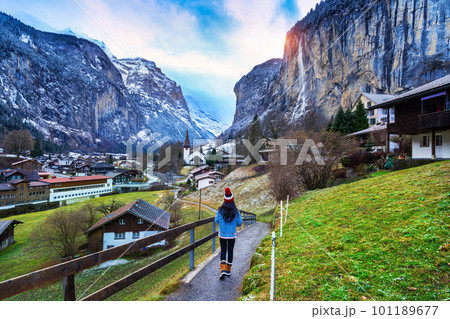 Tourist visiting village of Lauterbrunnen in the Bernese Oberland, Switzerland. 101189677