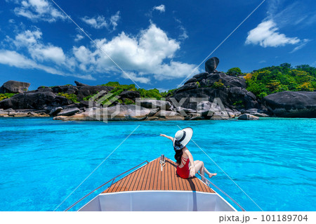 Female in bikini relaxing on yacht. Similan island in Thailand. Female in bikini relaxing on yacht. Similan island in Thailand. 101189704