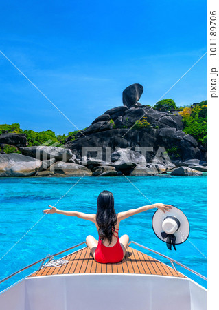Female in bikini relaxing on yacht. Similan island in Thailand. Female in bikini relaxing on yacht. Similan island in Thailand. 101189706