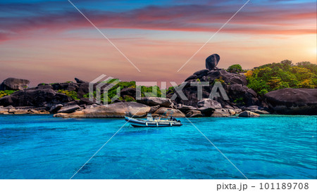 Tropical island at sunset. Sailboat rock with white sand beach at Similan island, Phang Nga, Thailand. Tropical island at sunset. Sailboat rock with white sand beach at Similan island, Phang Nga, Thailand. 101189708