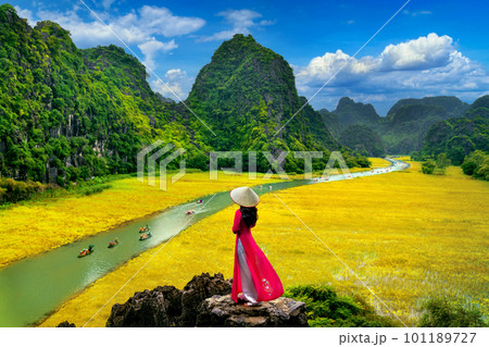 Asian woman wearing Vietnam culture traditional at Tam coc, Vietnam. 101189727