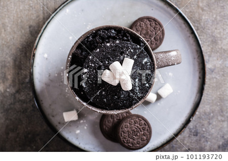 Close up of chocolate cake with marshmallows and powdered sugar for homemade dessert top view Close up of chocolate cake with marshmallows and powdered sugar for homemade dessert top view 101193720