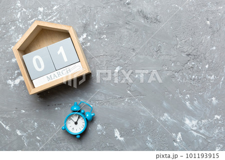 March 1st. Image of March 1 wooden block calendar on colored background. Summer day. Empty space for text 101193915