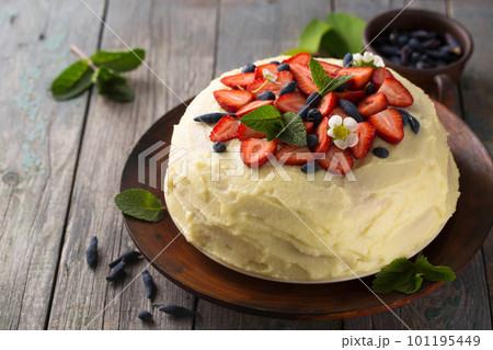 Homemade cake with custard and strawberries and honeysuckle Homemade cake with custard and strawberries and honeysuckle 101195449