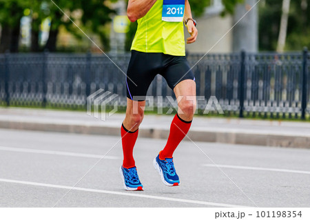 male runner in compression socks run marathon race 101198354