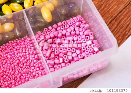 Colorful beads in containers close up, handicrafts Colorful beads in containers close up, handicrafts 101198373