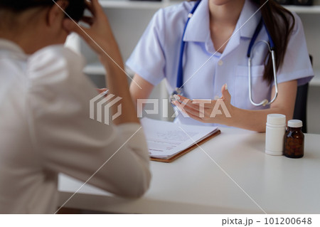 Doctor holding hand patient woman at clinic. health care, medical, healthy concept Doctor holding hand patient woman at clinic. health care, medical, healthy concept 101200648