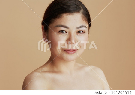 Portrait of modern asian female looking in camera Portrait of modern asian female looking in camera 101201514