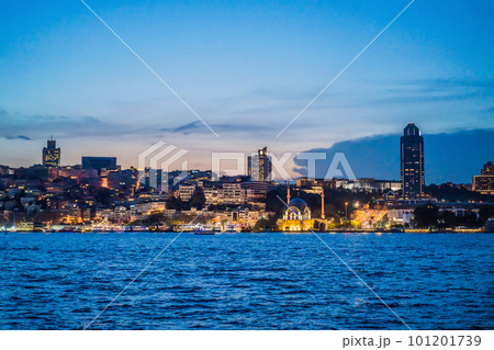 Istanbul at sunset, Turkey. Tourist boat sails on Golden Horn in summer. Beautiful sunny view of Istanbul waterfront with old mosque. Concept of travel, tourism and vacation in Istanbul and Turkey Istanbul at sunset, Turkey. Tourist boat sails on Golden Horn in summer. Beautiful sunny view of Istanbul waterfront with old mosque. Concept of travel, tourism and vacation in Istanbul and Turkey 101201739