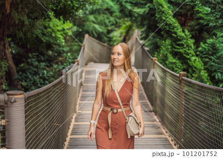 Woman tourist in Rope bridge in Yildiz Park. Besiktas, Istanbul, Turkey. Turkiye 101201752