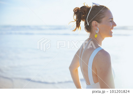 happy elegant woman in swimwear at beach having fun time 101201824