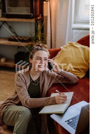 Young woman having home office in her apartment. 101202841