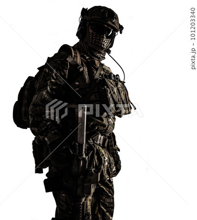 Low angle shot of a military army soldier in camouflage holding assault rifle. Studio shot, dark contrast, cropped, desaturated, isolated on white background Low angle shot of a military army soldier in camouflage holding assault rifle. Studio shot, dark contrast, cropped, desaturated, isolated on white background 101203340