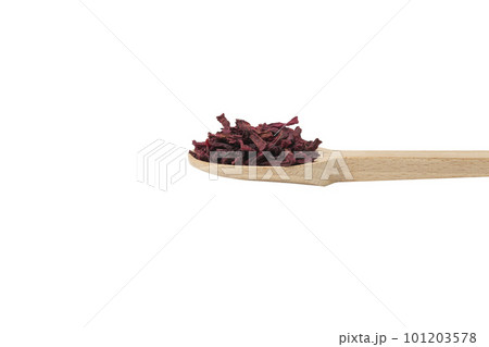 Dried beetroot slices on wooden spoon isolated on white background. Dried beetroot slices on wooden spoon isolated on white background. 101203578