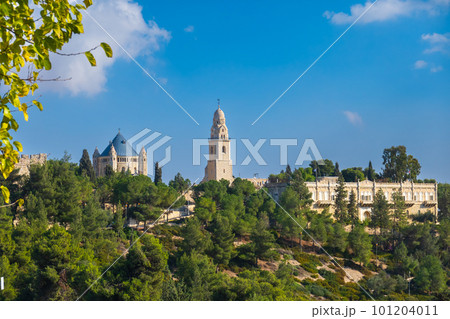 Old monastery surrounded by green trees 101204011