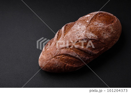 Delicious fresh crispy brown bread with cereal grains and spices 101204373