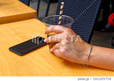 Young woman having a cup of coffee Young woman having a cup of coffee 101205750