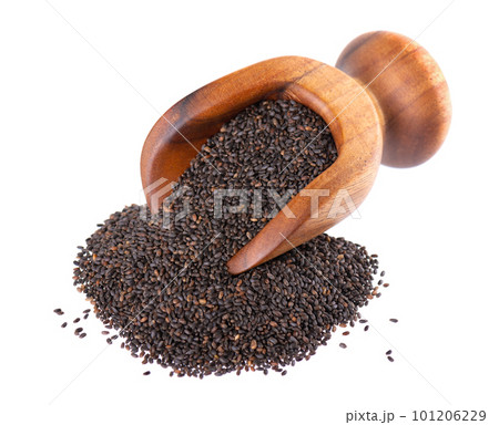 Basil seeds in wooden scoop, isolated on white background. Ocimum basilicum. 101206229