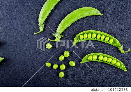 Sugar snap peas with mint on a rustic wood background 101212388