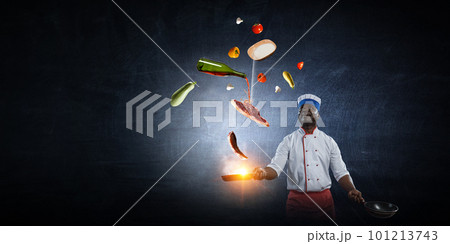 Chef cooking on black background 101213743