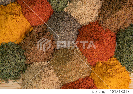 Heap different Asian Spices lies on wooden background. Spice and seasoning. Various fragrant spice market. Assortment spices and herbs for cooking Heap different Asian Spices lies on wooden background. Spice and seasoning. Various fragrant spice market. Assortment spices and herbs for cooking 101213813