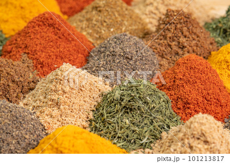 Heap different Asian Spices lies on wooden background. Spice and seasoning. Various fragrant spice market. Assortment spices and herbs for cooking Heap different Asian Spices lies on wooden background. Spice and seasoning. Various fragrant spice market. Assortment spices and herbs for cooking 101213817