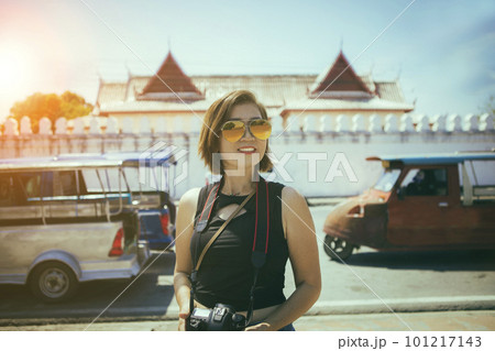 asian woman with dslr camera in hand standing infront of temple in ayutthaya world heritage site of unesco central of thailand asian woman with dslr camera in hand standing infront of temple in ayutthaya world heritage site of unesco central of thailand 101217143
