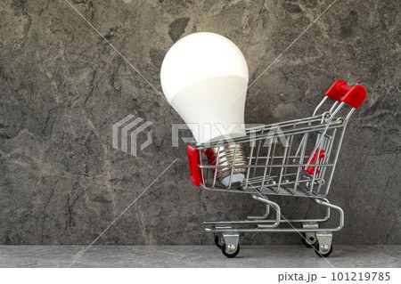 Shopping cart with bright glowing light bulb Shopping cart with bright glowing light bulb 101219785