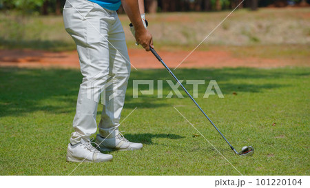 Golfer playing golf in the evening golf course, on sun set evening time 101220104