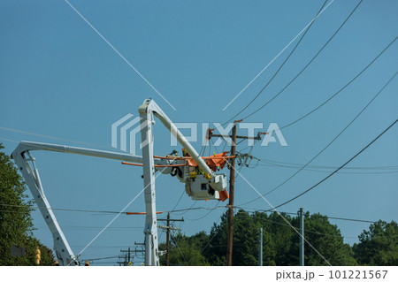 As a result of storm, electrical workers in the power pole maintenance industry were hired to repair damaged power lines. As a result of storm, electrical workers in the power pole maintenance industry were hired to repair damaged power lines. 101221567