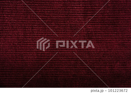 Burgundy red corduroy background texture. Ribbed velvet textile pattern 101223672