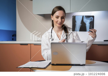 Female doctor using laptop computer online video call remote talking to patient, prescribe medicine. Telemedical, hospital clinic health care service 101224006