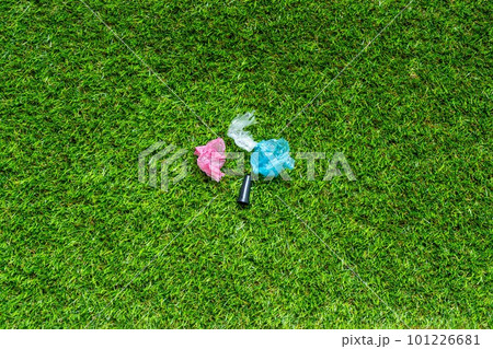 Mouthpiece for shisha om the green grass backround. Plastic waste concept. Plastic trash garbage, save nature. Parts of hookah, tobacco Hookah Shisha Mouthpiece on grass background. 101226681