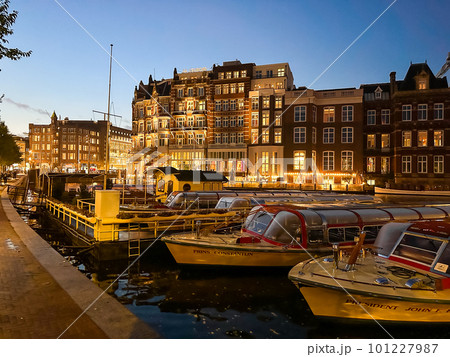 Damrak narrow houses at night in Amsterdam center, Netherlands Damrak narrow houses at night in Amsterdam center, Netherlands 101227987