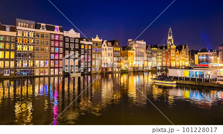 Damrak narrow houses at night in Amsterdam center, Netherlands Damrak narrow houses at night in Amsterdam center, Netherlands 101228017