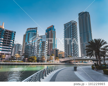 Dubai Marina, harbour, cruise boat and canal promenade view at sunset, in Dubai, United Arab Dubai Marina, harbour, cruise boat and canal promenade view at sunset, in Dubai, United Arab 101229965