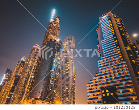 Dubai Marina, harbour, cruise boat and canal promenade view at night, in Dubai, United Arab Emirates Dubai Marina, harbour, cruise boat and canal promenade view at night, in Dubai, United Arab Emirates 101230128