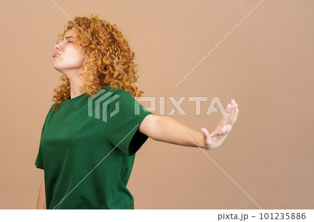 Woman gesturing that she wants to know nothing 101235886