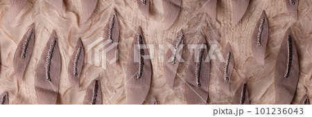 Fashion cloth decorated with fabric leaves texture background Fashion cloth decorated with fabric leaves texture background 101236043
