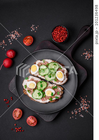 Delicious sandwiches consisting of grilled toast, canned tuna, cream cheese 101236498