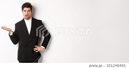 Man in black suit looking up Stock Photo by ©konstantynov 73149593