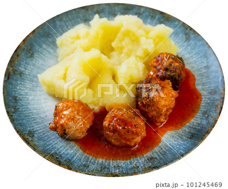 Nice tasty meatballs served with mashed potatoes and gravy on side 101245469
